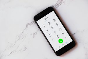 cell phone with "911" typed into it