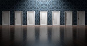 multiple white doors in a row next to each other