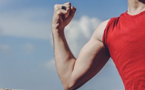 caucasian arm showing off the muscle