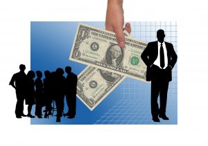 illustration of a silhouette of a man with silhuoette of many people on the other side and a hand holding dollar bills in between them