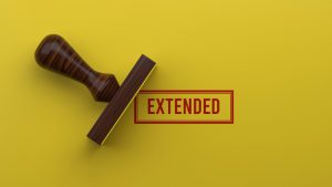 stamp laying next to the word extended