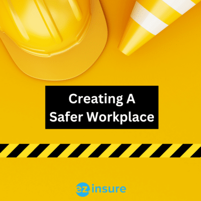 Creating A Safer Workplace text overlaying image of a work hat and dafety cone