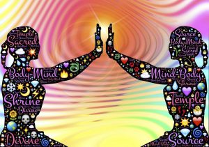 silhouette of two bodies facing each other with a hand up to one another and many little words of positivity within the body and symbols.