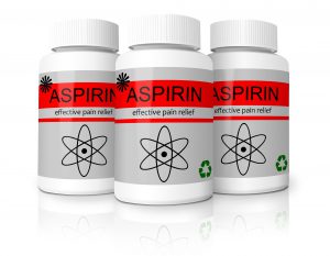 three white pill bottles with the word aspirin on them 