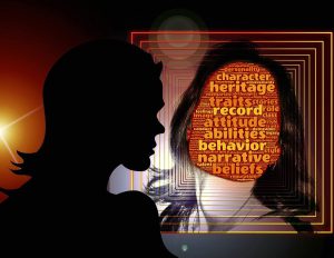 woman looking at herself with the face she is looking at filled with words.