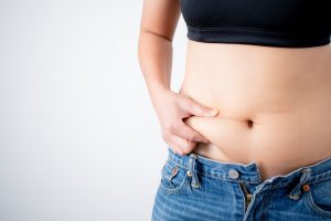 woman grabbing her belly