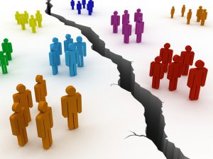 a crack in the ground dividing different colored groups