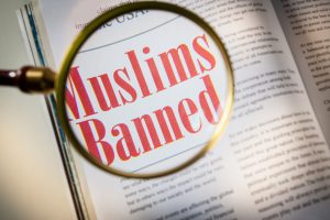 a magnifying glass over the words "mulsims banned"