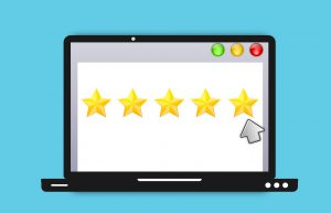 laptop screen with 5 yellow stars with a mouse pointing at the fifth star.