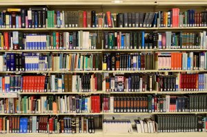 a wall of books in a library