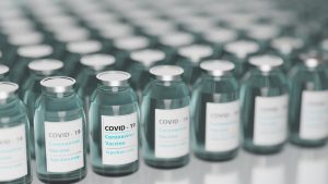 hundreds of vials with covid-19 label on them.