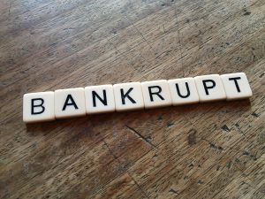 bankrupt spelled out in tiles