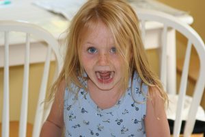 little caucasian girl screaming