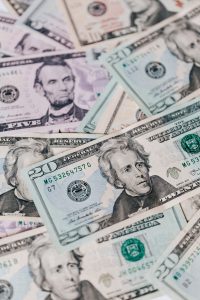 money bills laying on top of each other