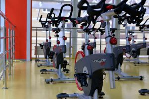 elliptical machines lined up in a gym