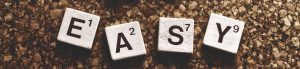 the word easy spelled out in scrabble letters
