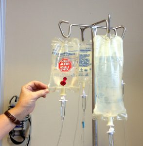 three different IV bags hanging