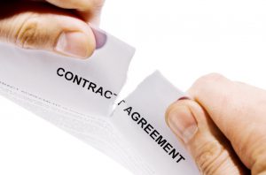 contract agreement being ripped in half