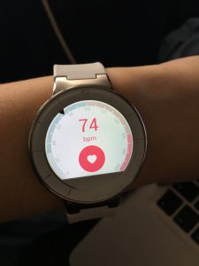 watch on someone's hand with the number 74 on it and bpm under the 74