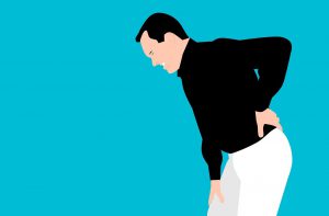 illustration of a man holding his lower back while hunched over