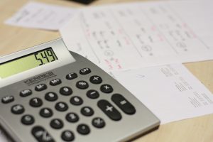 calculator with the numbers 549 on it and paper behind it in the background