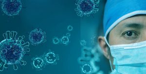 doctor with a blue mask on with viruses all around him