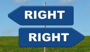 two arrow signs pointing in different directions with the word right on both.