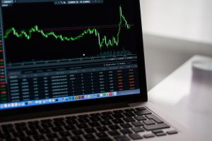 laptop screen with stock market on it
