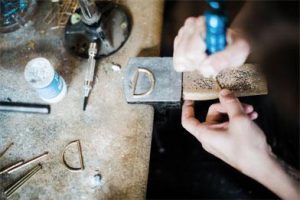 woman with a tool in her hand working