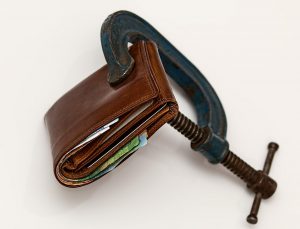 brown wallet with a wench tightening it