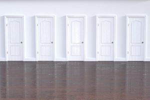 5 white doors next to each other