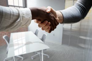 African american hand shaking a caucasian hand
