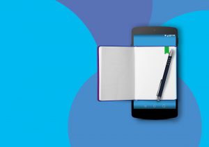 cell phone with a notebook over it and pen