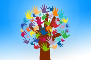 different colored hands forming a tree