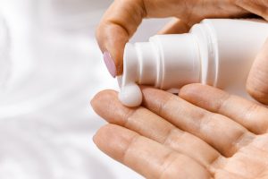 moisturizer being pumped out on a hand