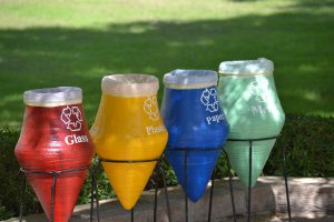 4 different colored recycling bins