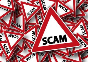 scam warning signs piled on top of each other