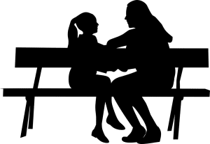 silhouette of a woman and a child talking on a bench