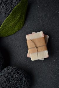 bar of soap wrapped up in brown paper.