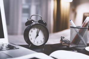 black clock on a table