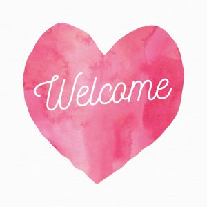 the word welcome in a pink heart