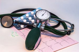 blood pressure cuff wrapped around medication 