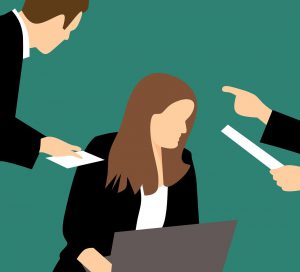 illustration of a woman sitting down with two people talking down to her