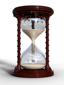 wooden framed hourglass with tan sand inside