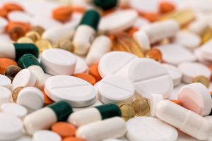 different medication pills in a pile.