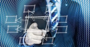 person in a suit pointing at a graph with many options