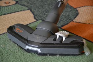vacuum running over a carpet