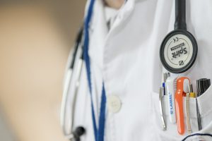 doctor lab coat with a stethoscope and pocket with pens