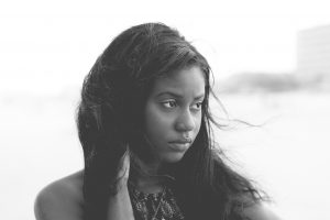 black and white picture of a young african american woman looking sad