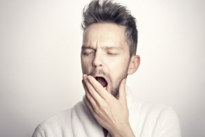 caucasian man yawning